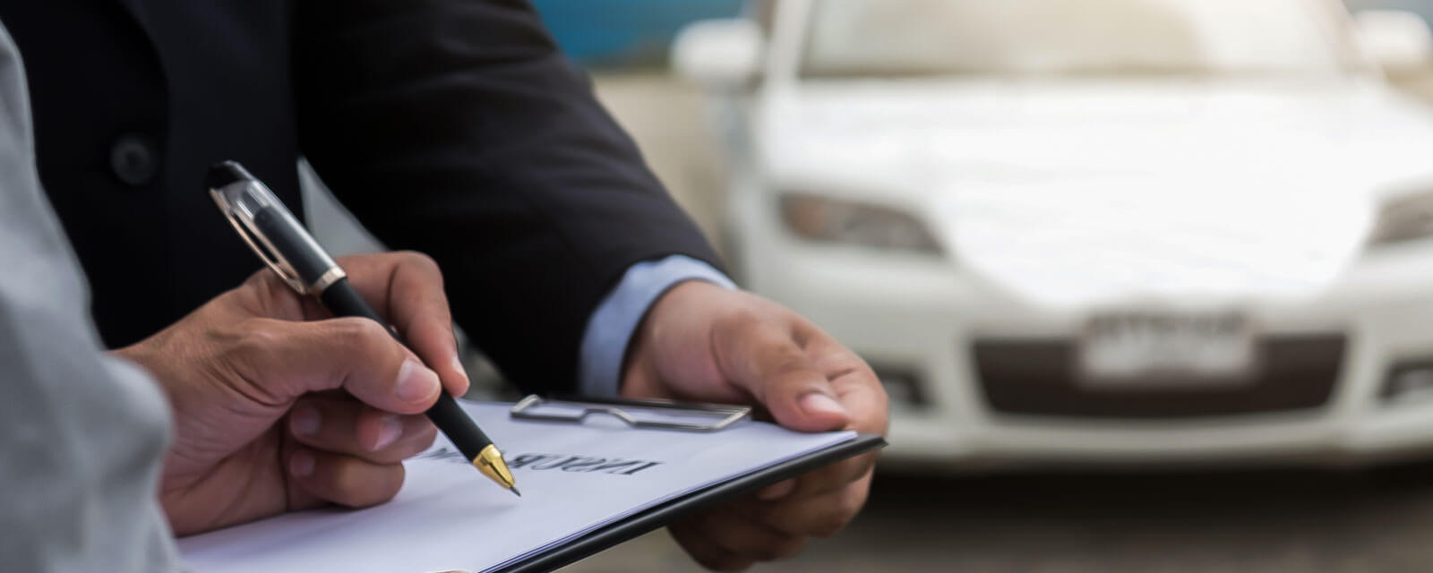 California driver reviews paperwork before filing Lemon Law claim